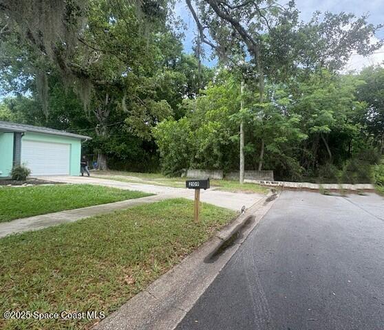 2109 Ivy Dr, Cocoa, FL 32922 - view of street with view of wooded area