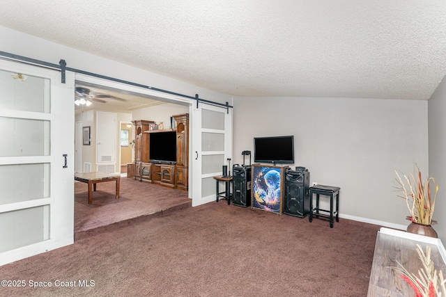 2109 Ivy Dr, Cocoa, FL 32922 - carpeted living room with a barn door and a textured ceiling
