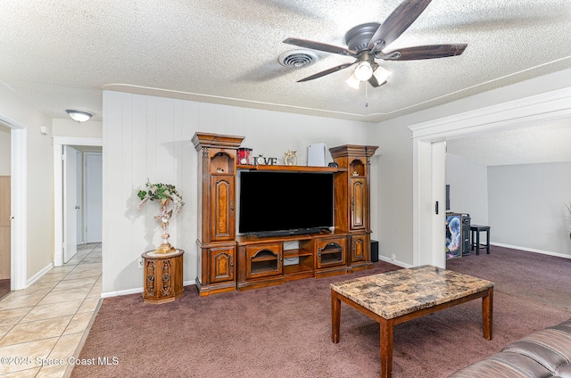 2109 Ivy Dr, Cocoa, FL 32922 - living room with ceiling fan, a textured ceiling, light carpet, baseboards, and light tile patterned floors