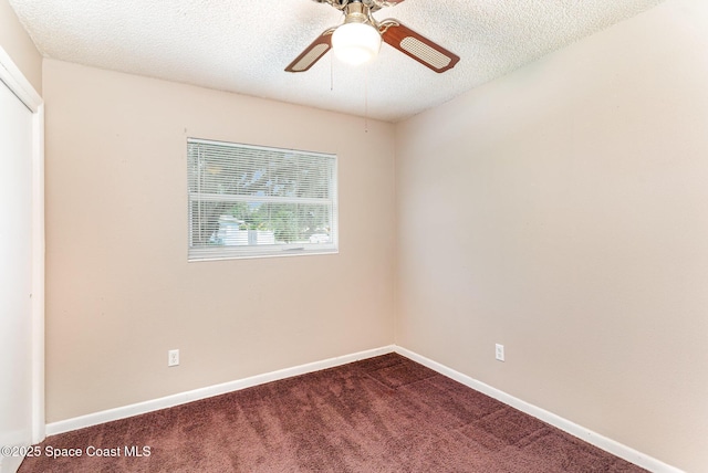 2109 Ivy Dr, Cocoa, FL 32922 - empty room featuring dark carpet, a textured ceiling, ceiling fan, and baseboards