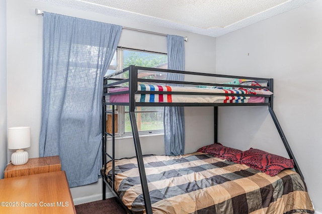 2109 Ivy Dr, Cocoa, FL 32922 - bedroom featuring carpet flooring, a textured ceiling, and baseboards
