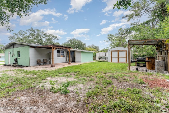 2109 Ivy Dr, Cocoa, FL 32922 - rear view of house with a pergola, a patio, and concrete block siding