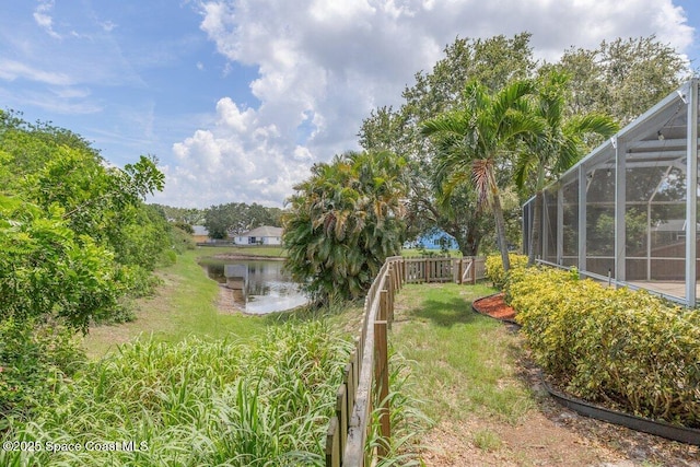 4843 Erin Ln, Melbourne, FL 32940 - view of yard with a water view and glass enclosure