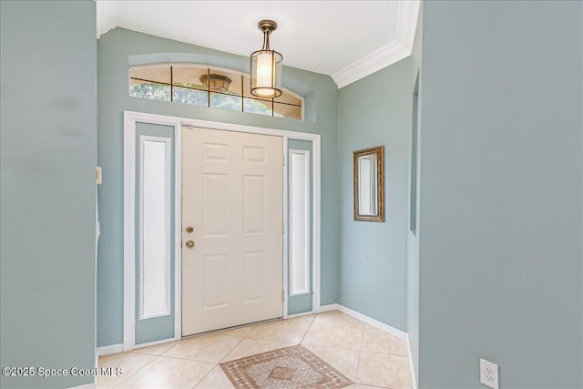 4843 Erin Ln, Melbourne, FL 32940 - entrance foyer with light tile patterned floors, lofted ceiling, and baseboards