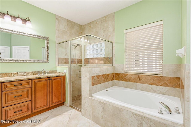 4843 Erin Ln, Melbourne, FL 32940 - full bath featuring a garden tub, vanity, a shower stall, and tile patterned flooring