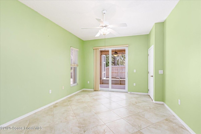 4843 Erin Ln, Melbourne, FL 32940 - spare room featuring a ceiling fan, light tile patterned floors, and baseboards