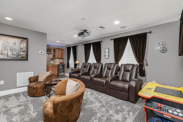 5145 Limousin Ct, Rockledge, FL 32955 - carpeted living room featuring bar area, wine cooler, recessed lighting, a textured ceiling, and baseboards