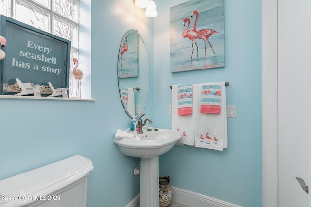 5145 Limousin Ct, Rockledge, FL 32955 - half bathroom featuring toilet and baseboards