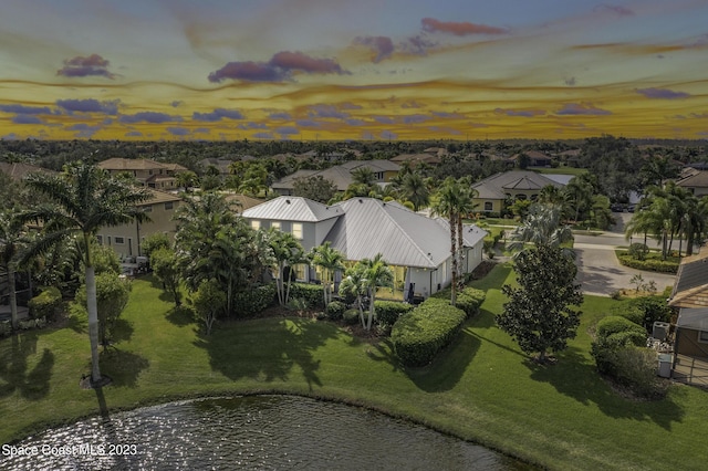 5145 Limousin Ct, Rockledge, FL 32955 - aerial view at dusk of a residential view and a water view