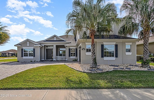 7690 Kerrington Dr, Melbourne, FL 32940 - single story home featuring stucco siding and a front lawn