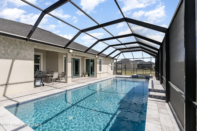 7690 Kerrington Dr, Melbourne, FL 32940 - view of pool featuring a patio, a pool with connected hot tub, and glass enclosure