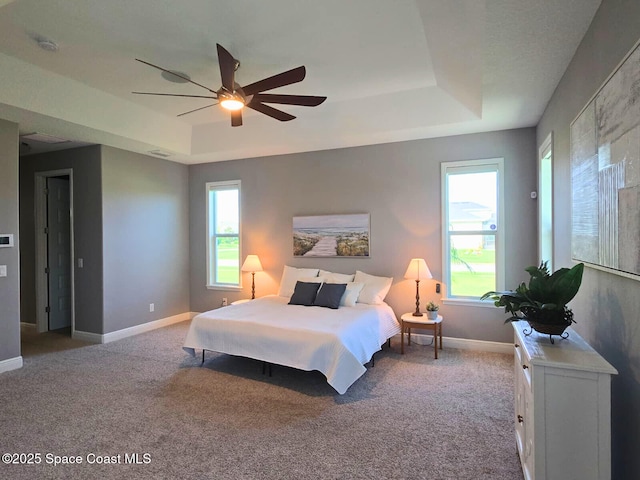 7690 Kerrington Dr, Melbourne, FL 32940 - bedroom featuring a raised ceiling, carpet, and ceiling fan