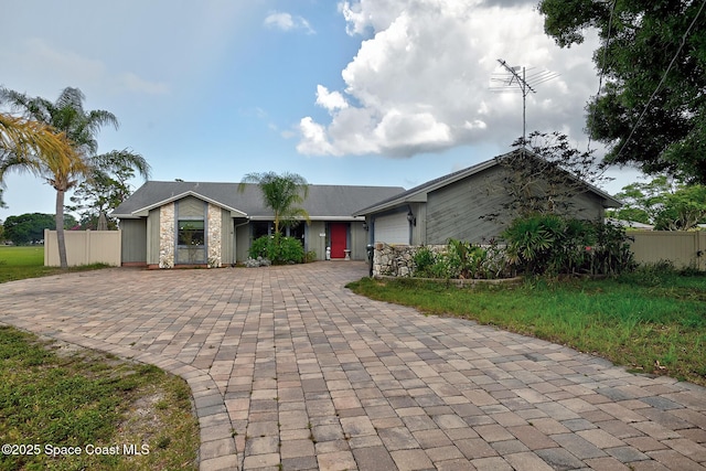 1387 Gleneagles Ct, Rockledge, FL 32955 - view of front of home featuring decorative driveway and an attached garage