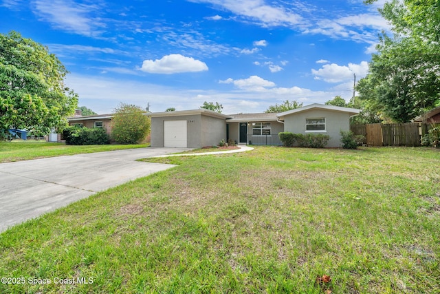 1941 Dawn Dr, Melbourne, FL 32935 - ranch-style home with stucco siding, a garage, and concrete driveway