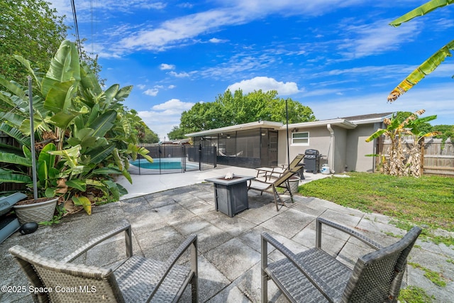 1941 Dawn Dr, Melbourne, FL 32935 - view of patio with a sunroom and a fire pit