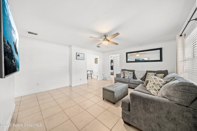 1941 Dawn Dr, Melbourne, FL 32935 - living room featuring ceiling fan, light tile patterned floors, ornamental molding, and baseboards