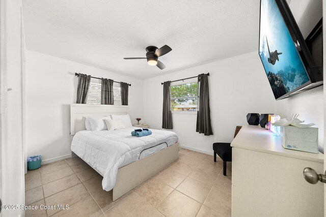 1941 Dawn Dr, Melbourne, FL 32935 - bedroom featuring light tile patterned floors, baseboards, and ceiling fan
