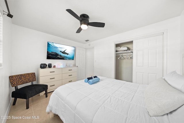1941 Dawn Dr, Melbourne, FL 32935 - bedroom with a closet, light tile patterned flooring, ceiling fan, and baseboards