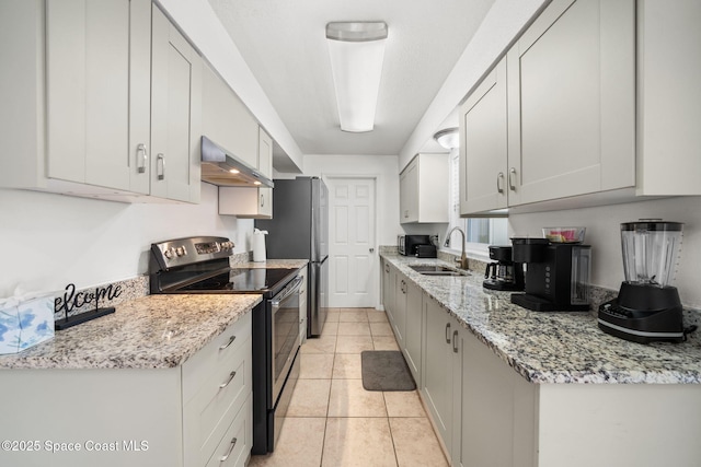 1941 Dawn Dr, Melbourne, FL 32935 - kitchen with exhaust hood, stainless steel appliances, a sink, light tile patterned flooring, and light stone counters
