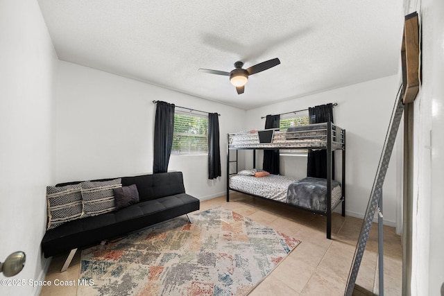 1941 Dawn Dr, Melbourne, FL 32935 - tiled bedroom featuring a textured ceiling and ceiling fan