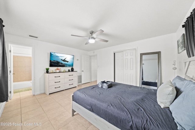1941 Dawn Dr, Melbourne, FL 32935 - bedroom featuring light tile patterned floors, baseboards, ceiling fan, and a closet