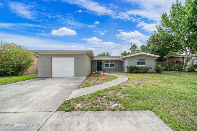 1941 Dawn Dr, Melbourne, FL 32935 - single story home featuring an attached garage, stucco siding, and concrete driveway
