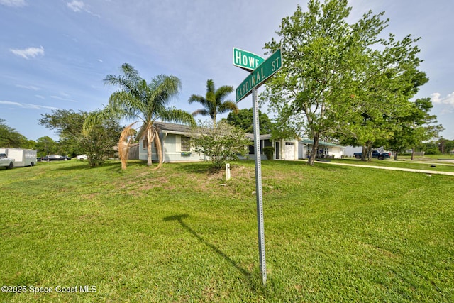 581 Howe Ave SE, Palm Bay, FL 32909 - view of property hidden behind natural elements featuring a front yard