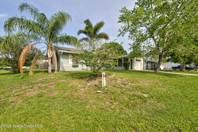 581 Howe Ave SE, Palm Bay, FL 32909 - view of front facade featuring a front yard