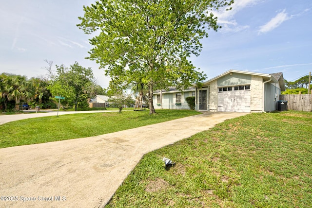 581 Howe Ave SE, Palm Bay, FL 32909 - ranch-style home featuring concrete driveway and a garage