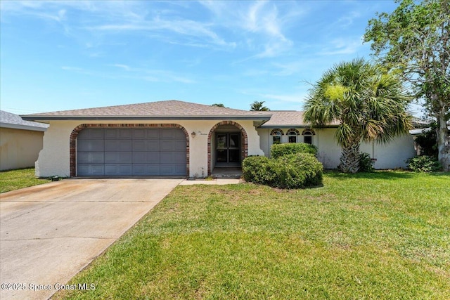 213 Harbour Dr W, Indian Harbour Beach, FL 32937 - view of front facade featuring driveway, a garage, a front yard, and stucco siding