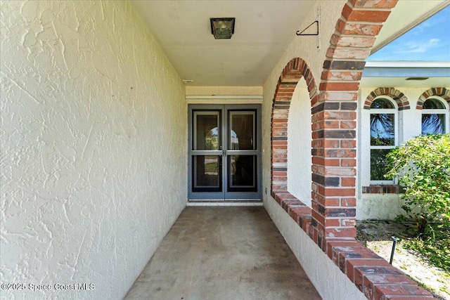 213 Harbour Dr W, Indian Harbour Beach, FL 32937 - property entrance with brick siding and stucco siding