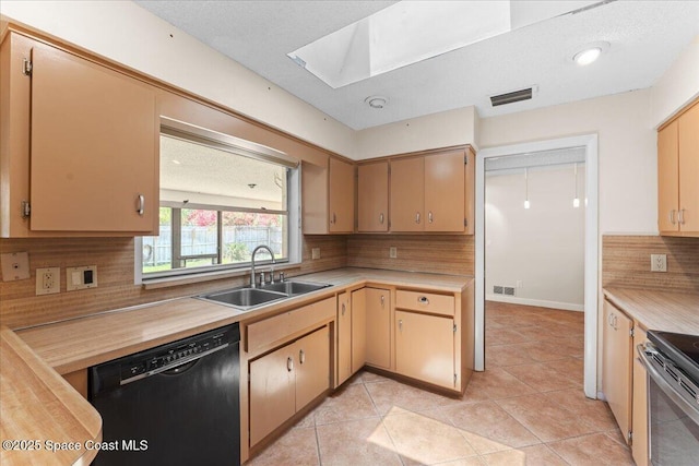 213 Harbour Dr W, Indian Harbour Beach, FL 32937 - kitchen featuring black dishwasher, a sink, a skylight, light countertops, and tasteful backsplash