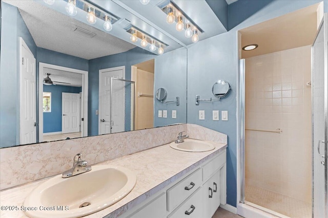 213 Harbour Dr W, Indian Harbour Beach, FL 32937 - full bath featuring double vanity, a stall shower, and ceiling fan