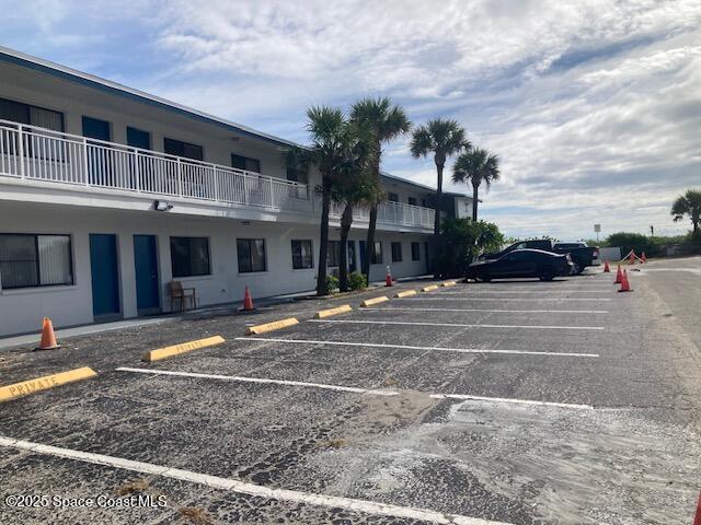 22 Tulip Ave Unit 318, Cocoa Beach, FL 32931 - view of uncovered parking lot
