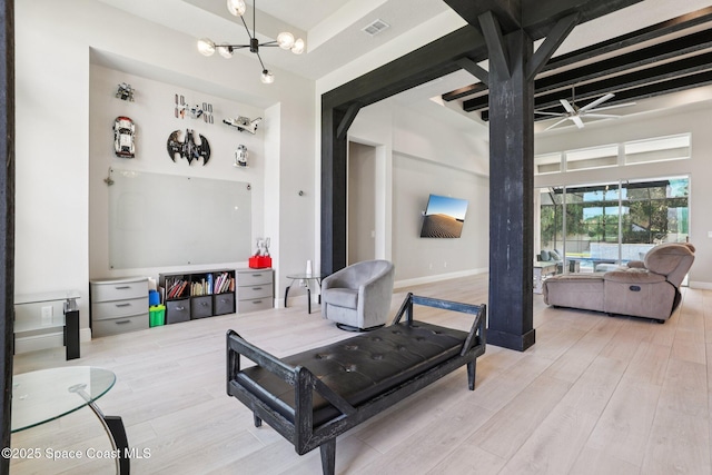 1025 Aranceto Cir, Merritt Island, FL 32952 - living area with ceiling fan, wood finished floors, a chandelier, and beam ceiling
