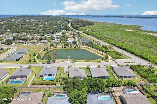 1025 Aranceto Cir, Merritt Island, FL 32952 - aerial perspective of suburban area featuring a large body of water and a pool