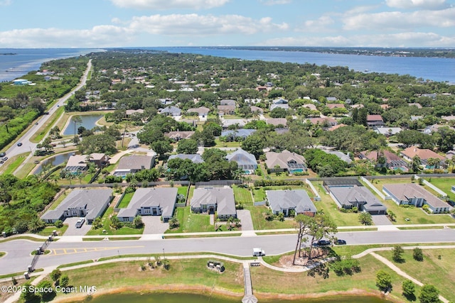 1025 Aranceto Cir, Merritt Island, FL 32952 - aerial view of property's location with nearby suburban area and a large body of water
