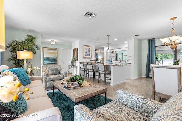 715 Atlantic Dr, Satellite Beach, FL 32937 - living area featuring a chandelier, light tile patterned floors, and recessed lighting