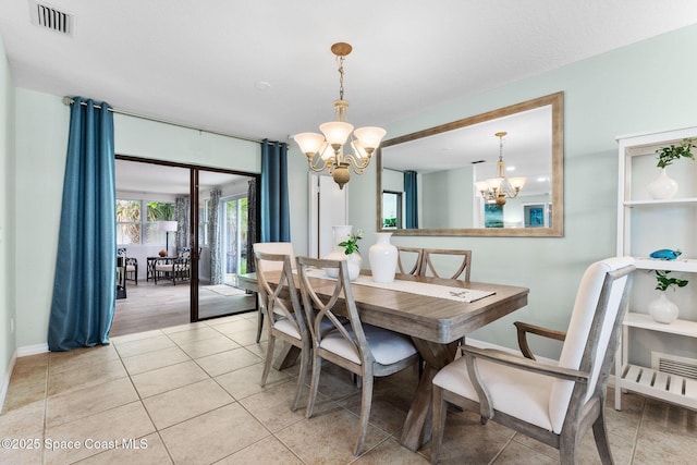 715 Atlantic Dr, Satellite Beach, FL 32937 - dining room with a chandelier and light tile patterned floors