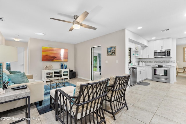 715 Atlantic Dr, Satellite Beach, FL 32937 - living room with ceiling fan, light tile patterned floors, and recessed lighting