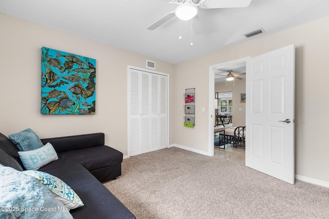 715 Atlantic Dr, Satellite Beach, FL 32937 - carpeted living area with ceiling fan and baseboards