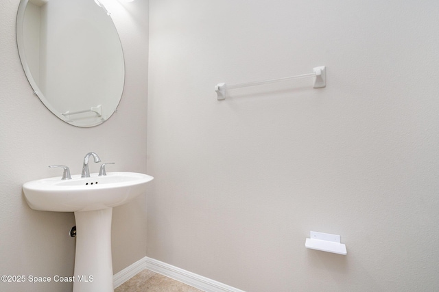 4778 Sprint Cir, Rockledge, FL 32955 - bathroom featuring baseboards and a sink