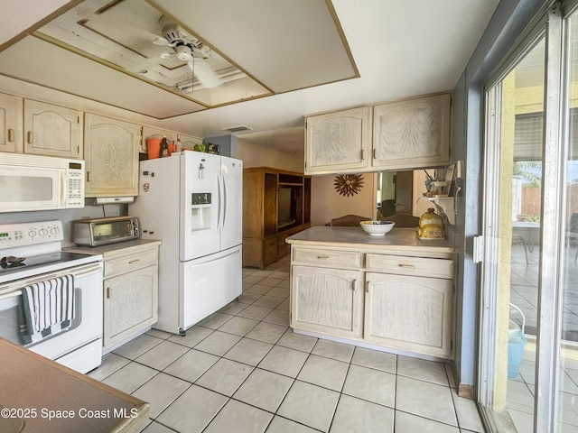 1395 Angler St, Merritt Island, FL 32952 - kitchen with white appliances and light tile patterned floors