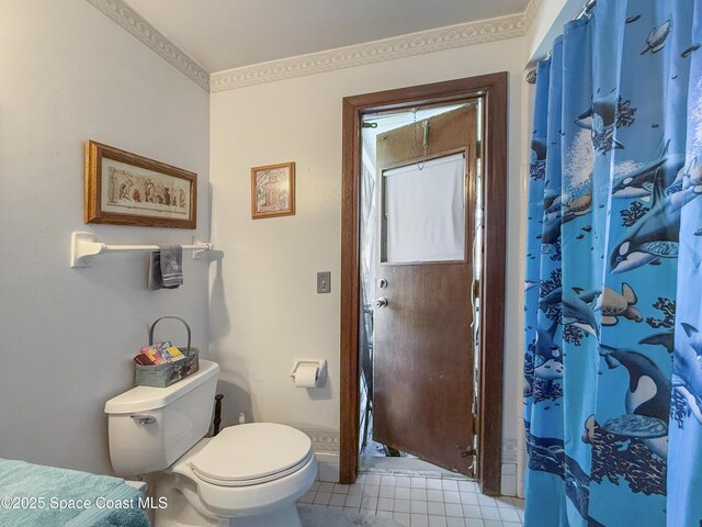 1395 Angler St, Merritt Island, FL 32952 - full bath with toilet, tile patterned flooring, and curtained shower