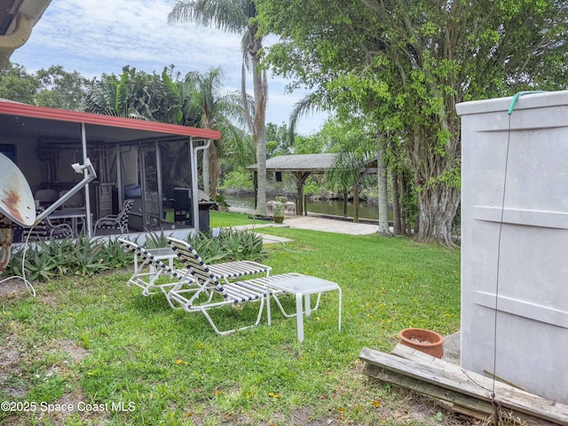 1395 Angler St, Merritt Island, FL 32952 - view of green lawn featuring a sunroom and a gazebo