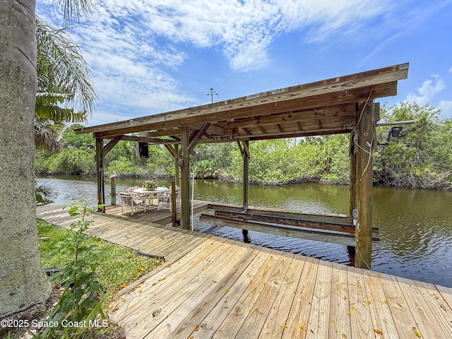 1395 Angler St, Merritt Island, FL 32952 - dock featuring a water view and boat lift