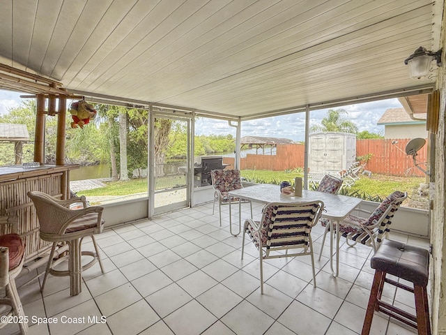 1395 Angler St, Merritt Island, FL 32952 - sunroom with outdoor dining area and a water view