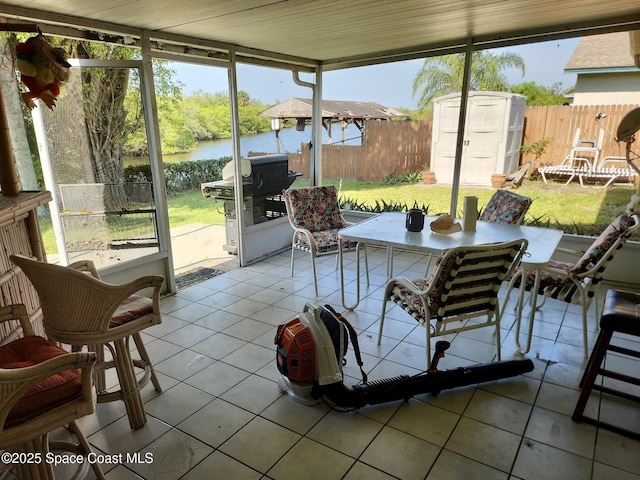 1395 Angler St, Merritt Island, FL 32952 - sunroom / solarium featuring a water view and outdoor dining area