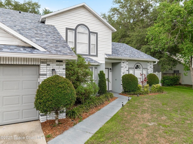 4236 Pondapple Dr, Titusville, FL 32796 - traditional-style house with a garage and a shingled roof