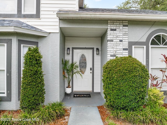 4236 Pondapple Dr, Titusville, FL 32796 - view of exterior entry featuring stucco siding